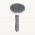 Brosse auto-nettoyante grise pour chien et chat